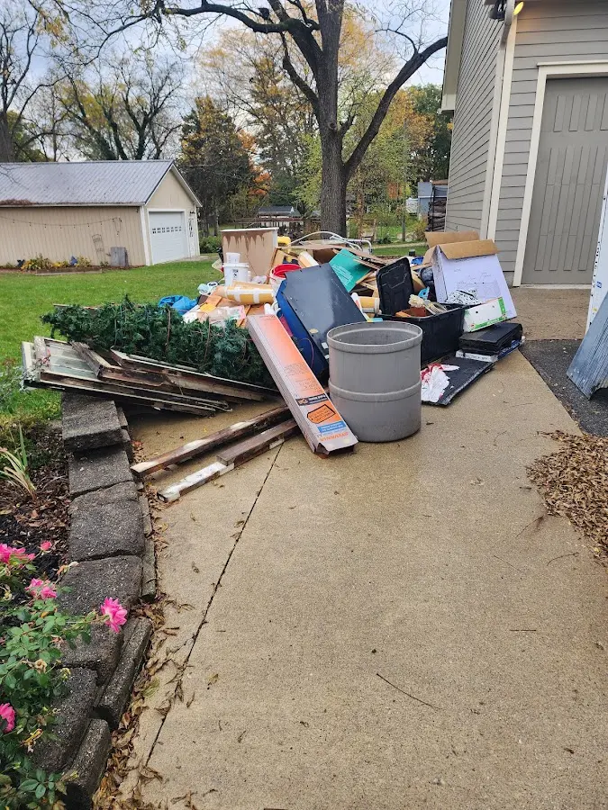 Dumpster being loaded with debris for Residential Dumpster Rental in Kuna